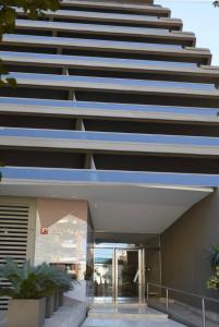 a large building with large white and blue steps at Departamento Tucuman in San Miguel de Tucumán