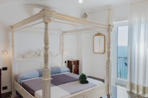Posteľ alebo postele v izbe v ubytovaní La Concha Suites