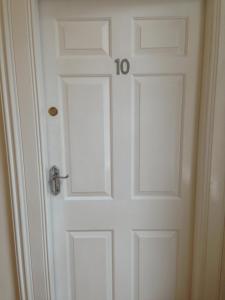 a white door with the number on it at PLATFORM City Studio with Parking in Hull
