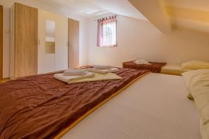 Posteľ alebo postele v izbe v ubytovaní Apartment LINDA