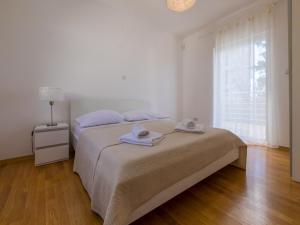 Postel nebo postele na pokoji v ubytování Villa CARPE DIEM