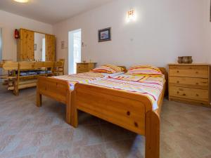 Postel nebo postele na pokoji v ubytování Apartments Ksenija
