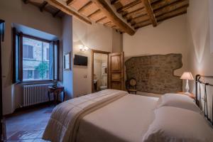 Una cama o camas en una habitación de Il Chiassetto Bolgheri