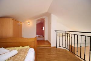 Posteľ alebo postele v izbe v ubytovaní Apartments IVONA 6