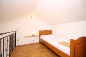 Posteľ alebo postele v izbe v ubytovaní Apartments IVONA 6