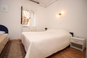 Posteľ alebo postele v izbe v ubytovaní Apartments IVONA 2