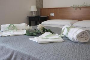 Postel nebo postele na pokoji v ubytování Hotel Leuco'