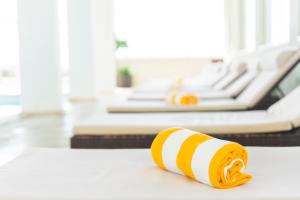 a yellow and white towel on the floor in a waiting room at Star inn Peniche in Peniche