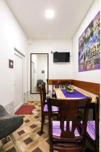 a dining room with a table and chairs at Hostel Put Svile in Subotica