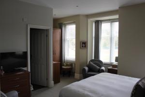 Ένα ή περισσότερα κρεβάτια σε δωμάτιο στο Brantfell House