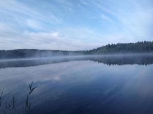 a large body of water with fog on it at Holiday Home Käkiharju by Interhome in Sulkava