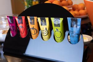 a row of colorful socks on a table with oranges at Stay Hotel Faro Centro in Faro