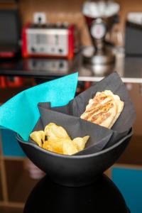 a bowl of food with chips in it at Stay Hotel Faro Centro in Faro