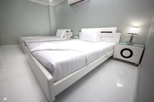 Postel nebo postele na pokoji v ubytování White Fort Hotel