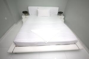 Postel nebo postele na pokoji v ubytování White Fort Hotel