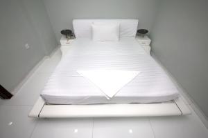 Postel nebo postele na pokoji v ubytování White Fort Hotel