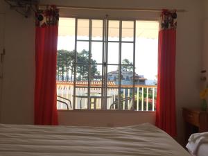 Ένα ή περισσότερα κρεβάτια σε δωμάτιο στο Las Tilapias Hotel