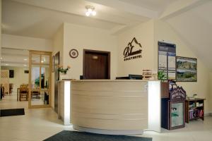 a lobby of a pharmacy with a reception counter at Aparthotel Bellamonte in Zakopane +291 photos