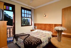 Een bed of bedden in een kamer bij Boroni Palace Hotel