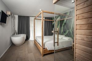 Postel nebo postele na pokoji v ubytování Hotel San Giacomo Spa&Gourmet