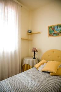 A bed or beds in a room at VILLETTA CON GIARDINO