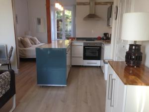 A kitchen or kitchenette at St Guenole' Studio Apartment