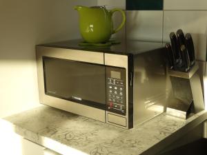 Kuchyňa alebo kuchynka v ubytovaní Apartament z widokiem na morze - Apartament Turkusowy