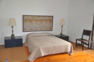 Uma cama ou camas num quarto em Convento de São Francisco