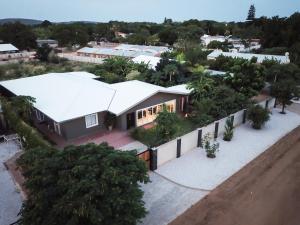 an aerial view of a house with trees and buildings at Haus Mopanie in Tsumeb