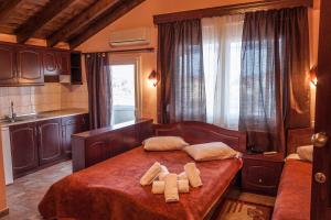 Posteľ alebo postele v izbe v ubytovaní Filippion Hotel