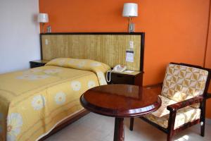Postel nebo postele na pokoji v ubytování Hotel Baluarte