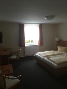 Postel nebo postele na pokoji v ubytování Döbelts Hotel Schützenhaus Jessen
