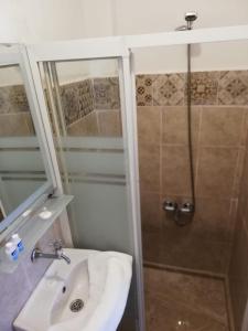 a bathroom with a sink and a shower at Urkmez Hotel in Selcuk +57 photos