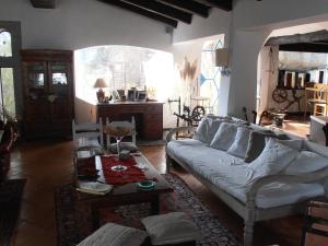 a living room with a couch and a table at Casa Alianda in Telti