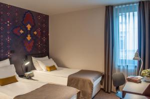 Katil atau katil-katil dalam bilik di Hotel Mrak