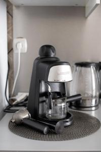 a coffee maker sitting on top of a counter at Prime Home Midtown Budapest in Budapest