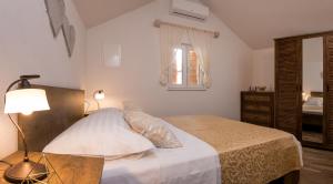 Ένα ή περισσότερα κρεβάτια σε δωμάτιο στο Apartment Cesarica