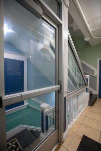 a view of a swimming pool through a window at Sunnyside Hotel-Downtown San Francisco in San Francisco