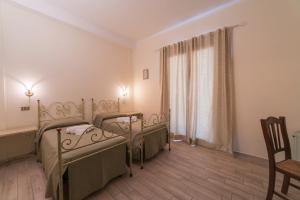 Postel nebo postele na pokoji v ubytování Villa Alberta Hotel