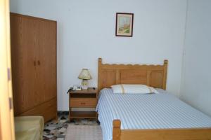 Postel nebo postele na pokoji v ubytování Hotel Moderno