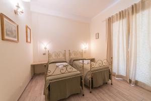 Postel nebo postele na pokoji v ubytování Villa Alberta Hotel