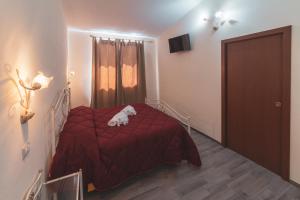 Postel nebo postele na pokoji v ubytování Villa Alberta Hotel
