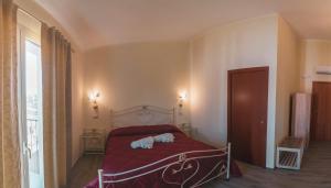 Postel nebo postele na pokoji v ubytování Villa Alberta Hotel