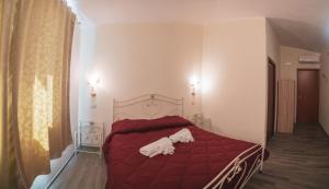 Postel nebo postele na pokoji v ubytování Villa Alberta Hotel