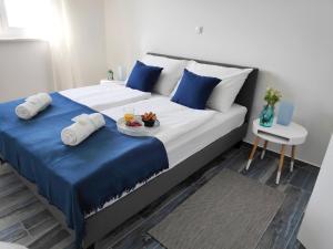 Postel nebo postele na pokoji v ubytování Maristo Apartments