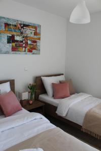 Postel nebo postele na pokoji v ubytování Maristo Apartments