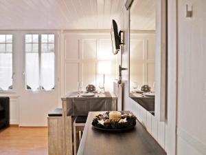 a kitchen with a table with a bowl of food on it at Chalet Maria Interlaken in Interlaken