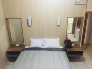 Cama o camas de una habitación en Class Apart Hotel