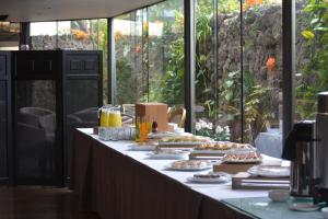 a buffet line with food and drinks on it at Jose Antonio Executive in Lima