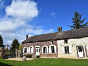 a large brick building with a blue sky in the background at Spacious holiday home in Sormery with pool in Sormery